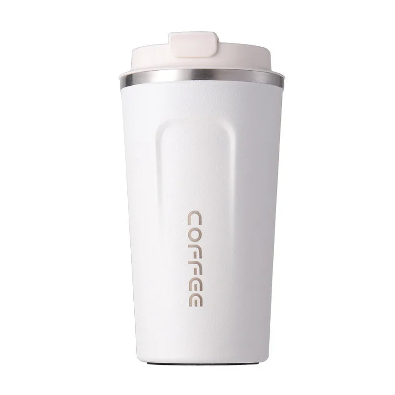White insulated coffee tumbler with silver lid on a white background