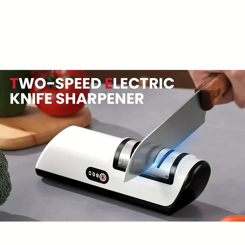 Two-speed electric knife sharpener with a knife being sharpened on a kitchen counter.