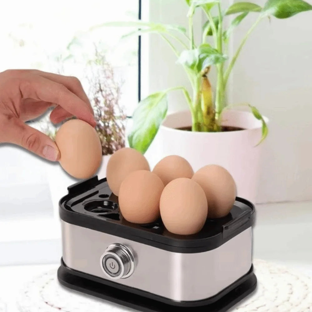 Egg cooker with eggs and a hand placing an egg on top, with a plant in the background.