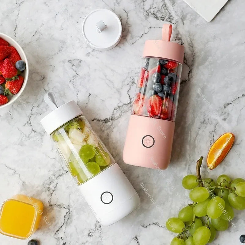 Two portable blenders with fruits on a marble surface