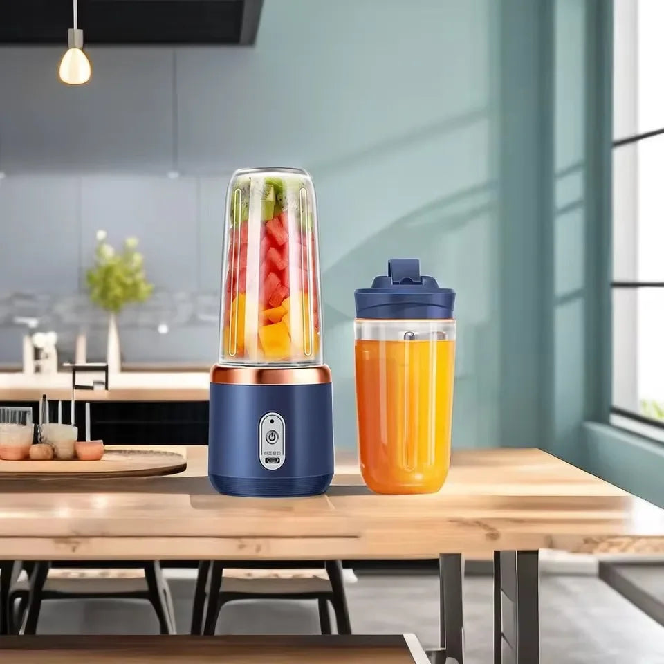 Portable blender with a container of juice on a kitchen counter