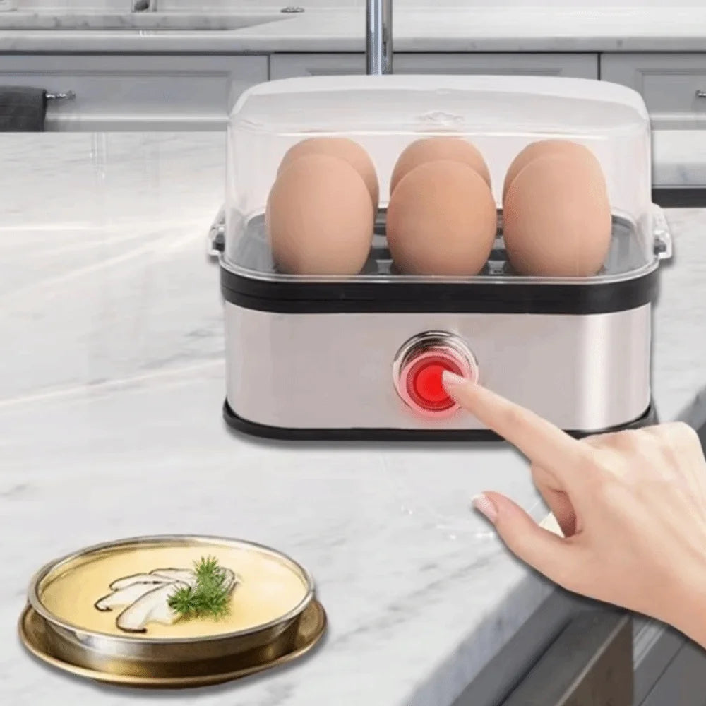 Electric egg cooker with eggs on a kitchen counter, hand pressing a button.