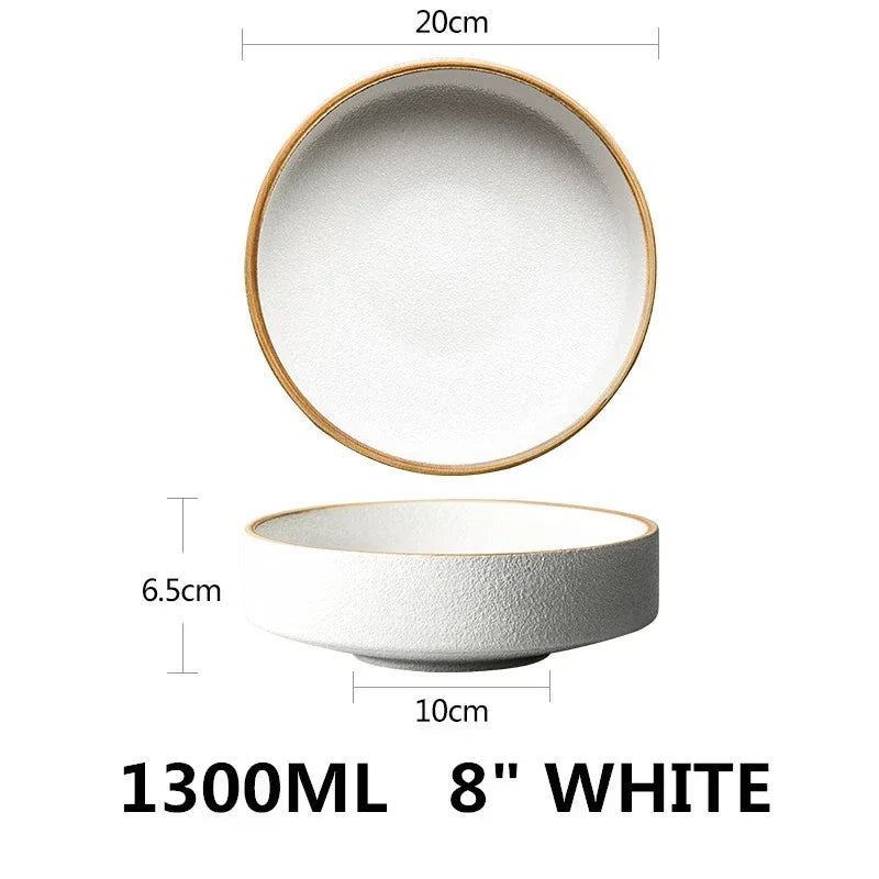 White ceramic bowl with gold rim and measurements on a white background
