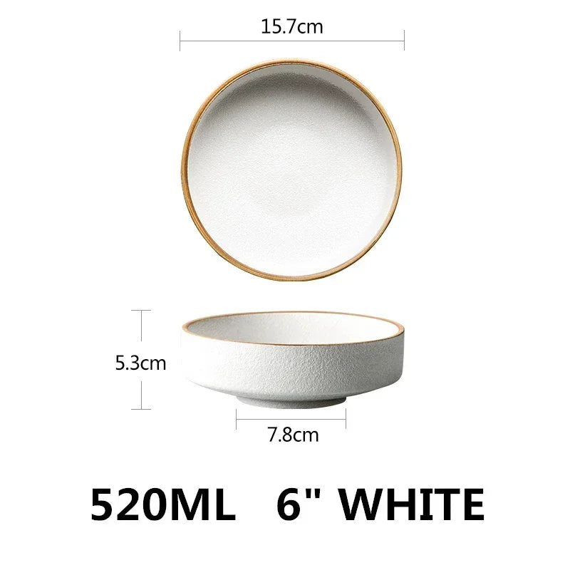 White ceramic bowl with gold rim and measurements on a white background