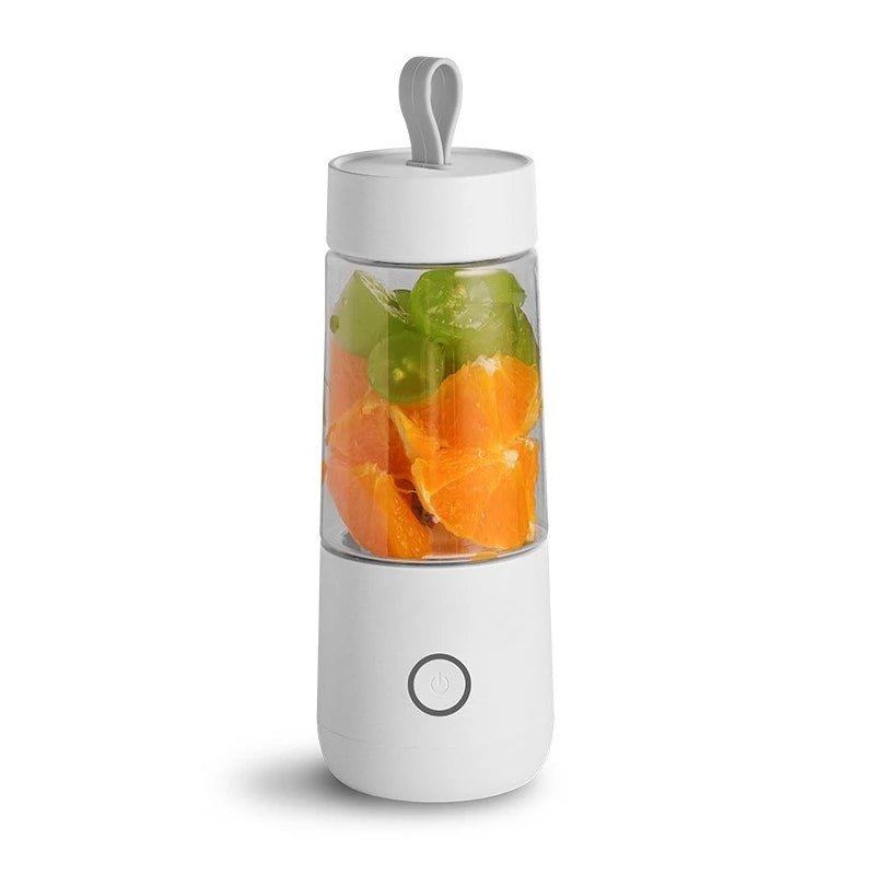 Portable blender with fruits inside on a white background