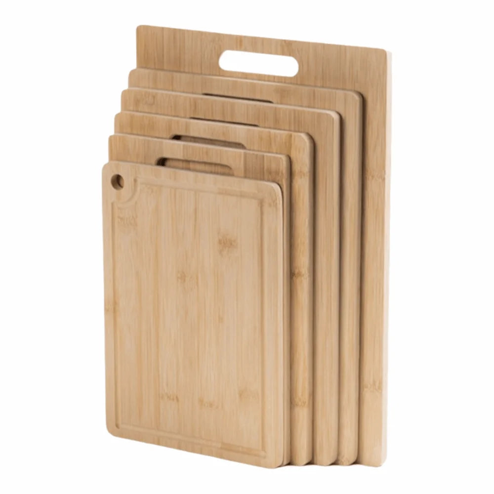 Set of bamboo cutting boards of different sizes on a white background