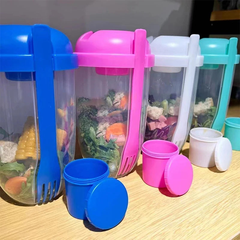 Colorful plastic containers with food模拟品 on a wooden surface