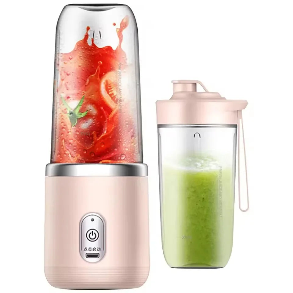 Portable blender with a clear container filled with red fruit and green smoothie on a white background