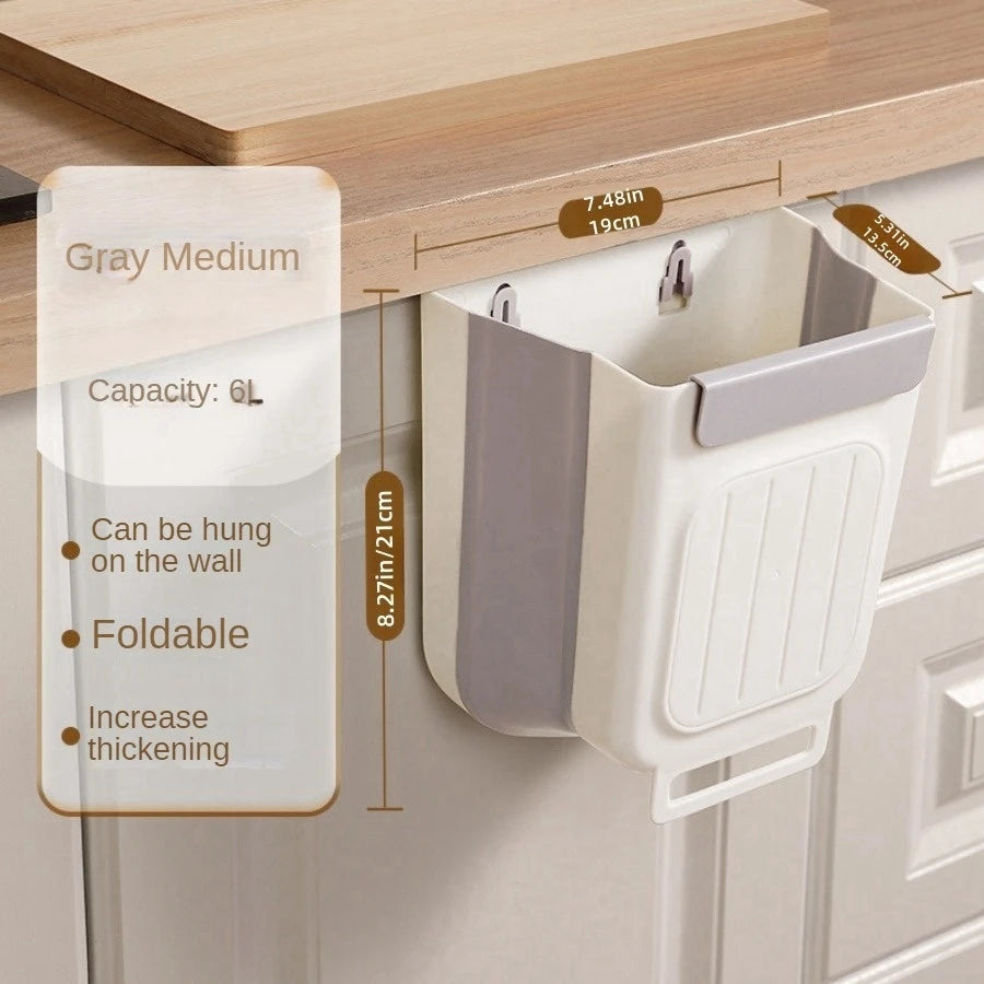 Wall-mounted trash bin with hanging mechanism on a wooden surface