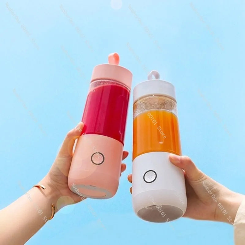 Two portable blenders held by hands against a blue sky background