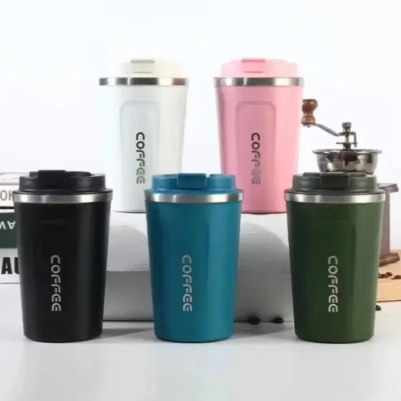 Set of colorful coffee tumblers with 'COFFEE' text on a white background